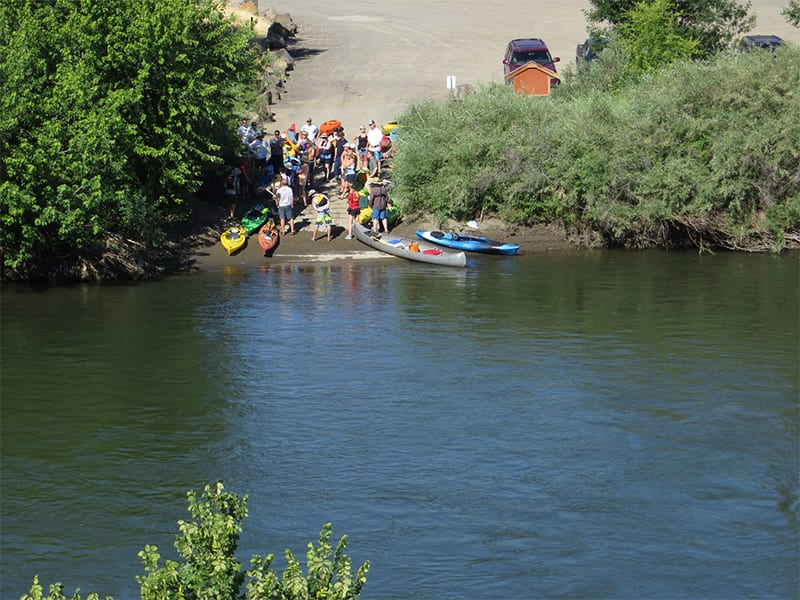 Kayakers by river